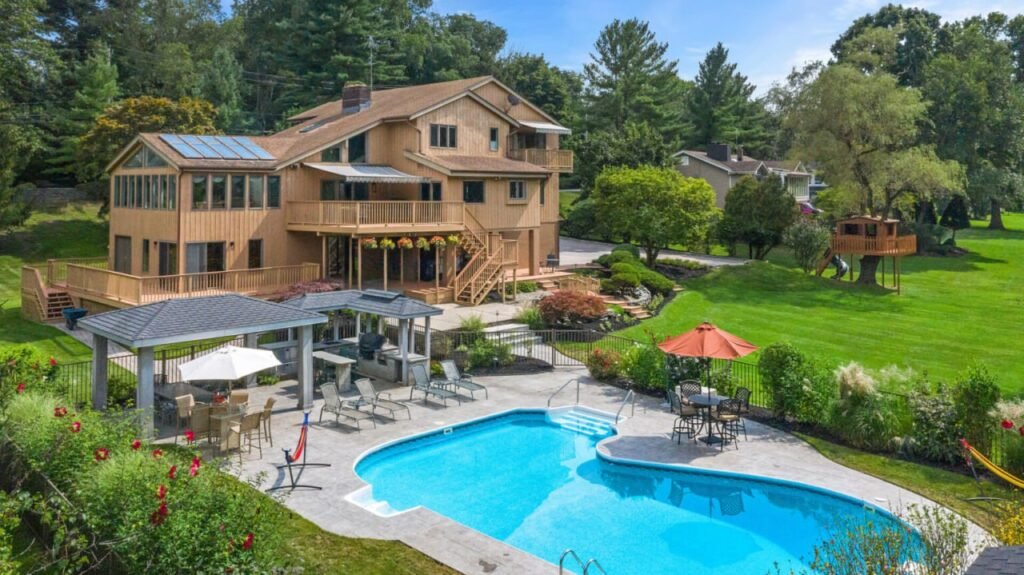 Drone photo of a luxury home with pool